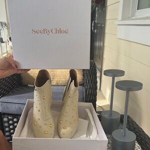 See By Chloe Cream Heeled Boots with Gold Accents